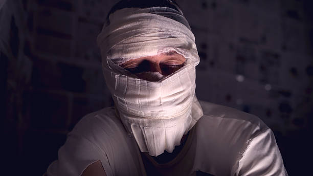 Caucasian man with a tape on eye.