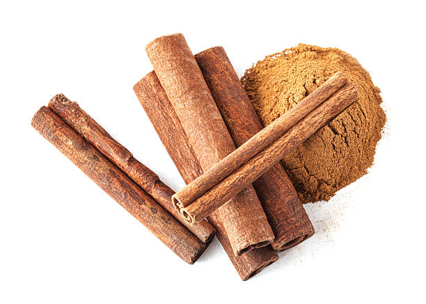 istock Dry aromatic cinnamon sticks and powder isolated on white, top view 2254714535