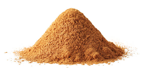 Pile of dry aromatic cinnamon powder isolated on white