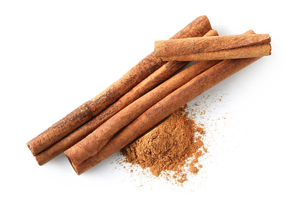 istock Dry aromatic cinnamon sticks and powder isolated on white, top view 2254714616