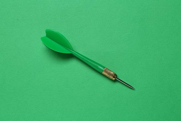 One dart arrow on green background, top view