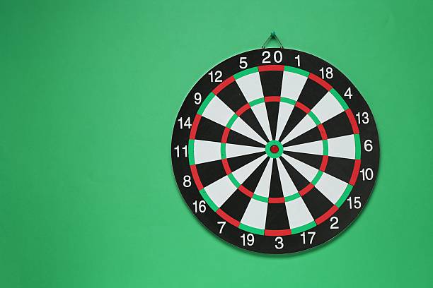Dartboard and four darts, red and green