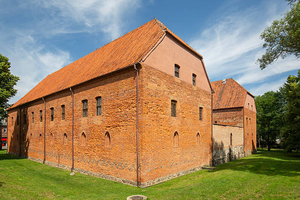 Ostroda, Poland - July 26, 2020: General view of 14th century gothic Teutonic order Ostroda Castle, red brick fortress built by Crusaders. It now houses museum and knights' brotherhood