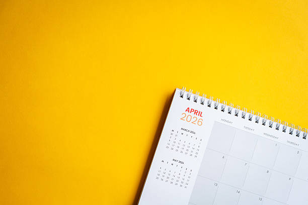 istock April 2026 desk calendar on yellow surface. 2254718672