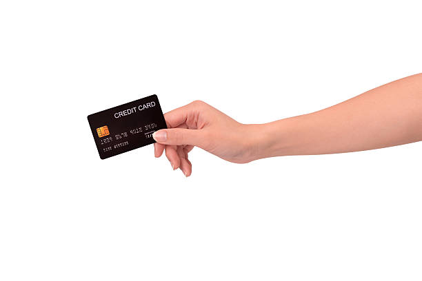 istock Hand holding a credit card isolated on white background. High resolution, high quality studio shot. Concept for technology, business, finance, advertising, E-commerce, Shopping and lifestyle themes. 2254719031