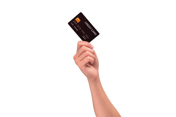 istock Hand holding a credit card isolated on white background. High resolution, high quality studio shot. Concept for technology, business, finance, advertising, E-commerce, Shopping and lifestyle themes. 2254719033