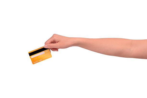 istock Hand holding a credit card isolated on white background. High resolution, high quality studio shot. Concept for technology, business, finance, advertising, E-commerce, Shopping and lifestyle themes. 2254719056