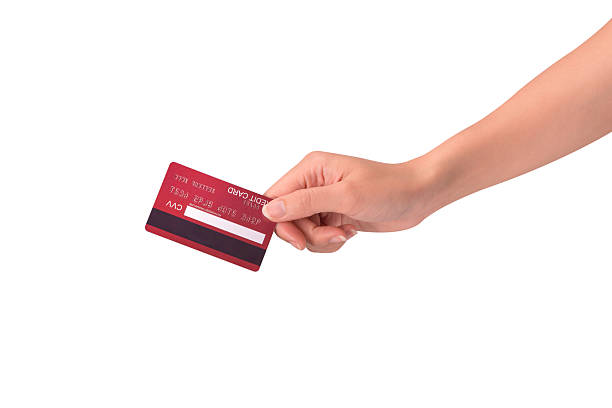 istock Hand holding a credit card isolated on white background. High resolution, high quality studio shot. Concept for technology, business, finance, advertising, E-commerce, Shopping and lifestyle themes. 2254719057