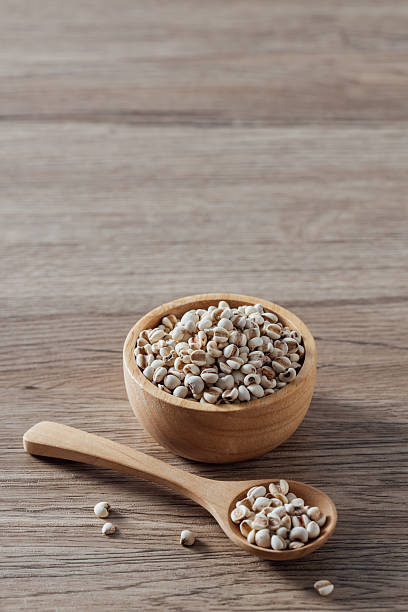istock Natural Organic Grains in Wooden Bowl and Spoon on Rustic Table 2254719901