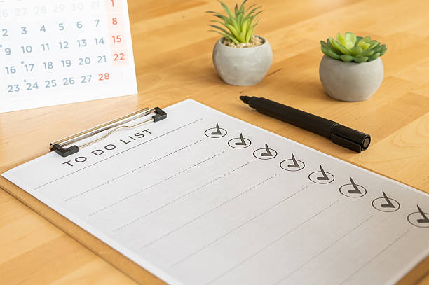 istock White checklist on clipboard with many tasks checked off, marker pen, calendar and small succulents on a clean wooden desk  productivity, planning and organized workflow 2254720994
