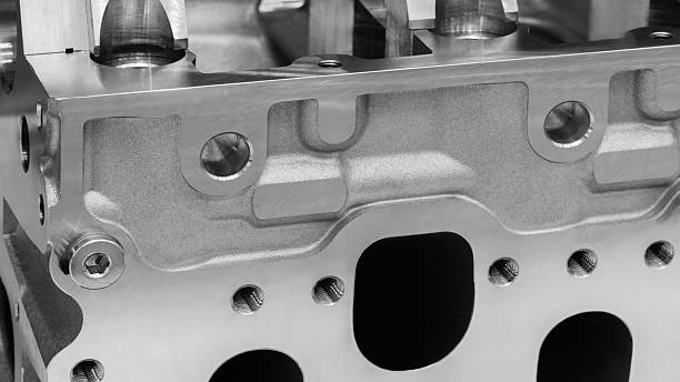 Close-up of a disassembled silver car engine auto service concept background.