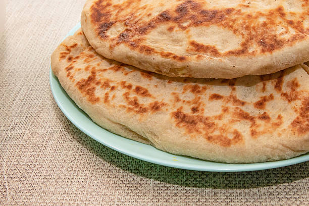 istock Homemade fried pies with golden crust served in bowl on kitchen table 2254724241