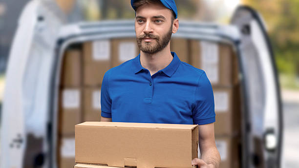 istock delivery person carrying boxes 2254725000