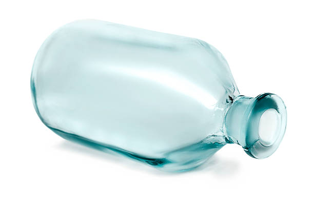 Empty medicine glass bottle lying on white background