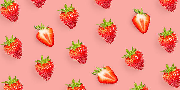 istock Strawberry pattern on pink background. Minimalist repeat composition with fresh whole and sliced strawberries 2254729932