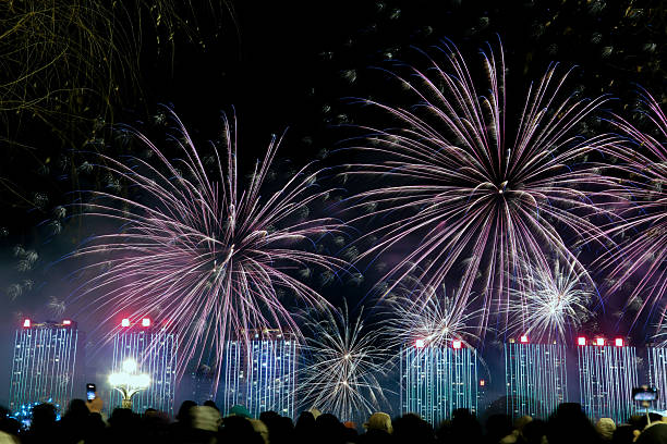 People watch the large fireworks display.