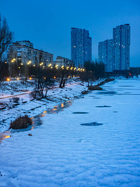 istock Kyiv urban landscape with frozen river during twilight 2254731408