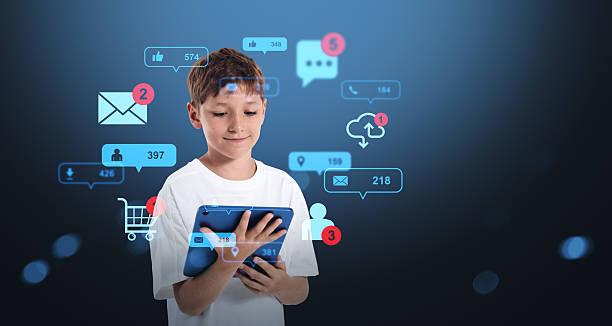 istock Kid using tablet with social media and technology icons around h 2254731902