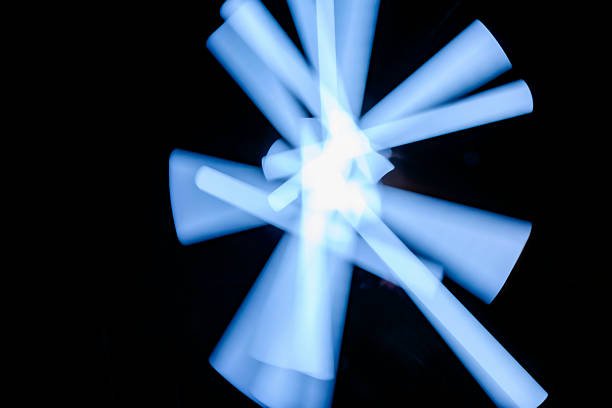 Abstract image of blurred blue light painting on a black background, creating a modern and artistic effect. Ideal for backgrounds, textures, or abstract designs
