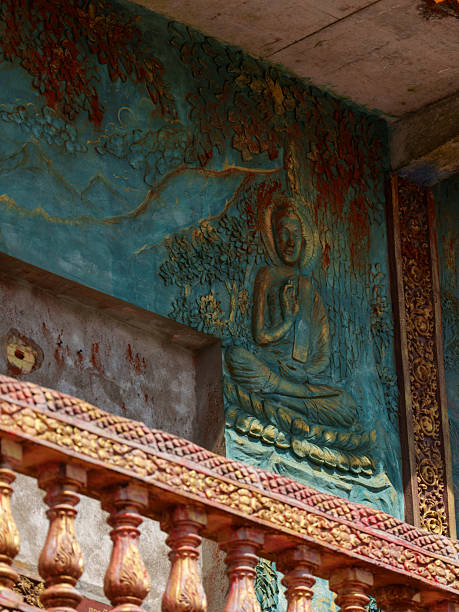 Stone bas-relief carved into a temple wall at Wat Sampov Pram Buddhist temple in Cambodia