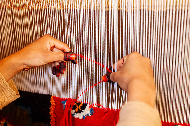 istock Berber woman weaving textiles, Ouarzazate, Morocco 2254743920
