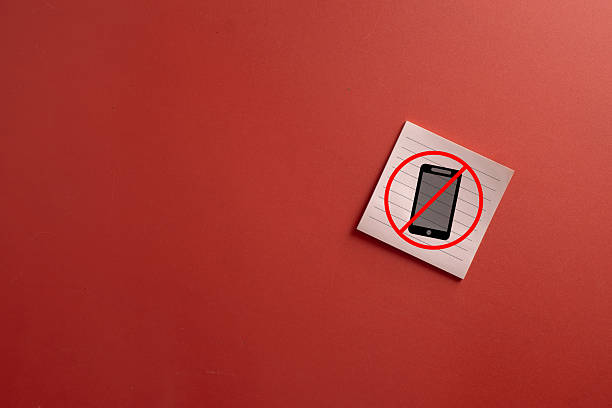 istock No Mobile Phone Sign on Sticky Note with Red Background 2254747466