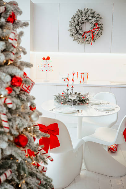 istock Elegant kitchen table setting with festive tree, wreath, and cheerful decorations. 2254751429