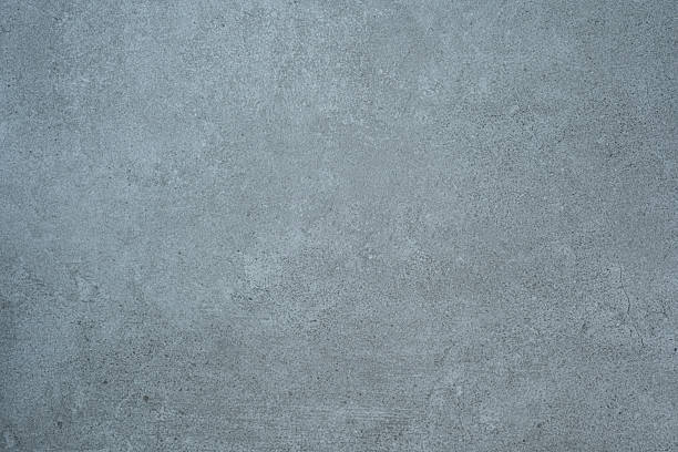 istock Blue toned concrete wall texture background with fine details and surface grain 2254751840
