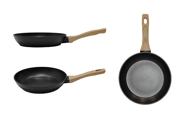 istock A black pan with a wooden handle is shown in different angles isolated on a white background 2254753402