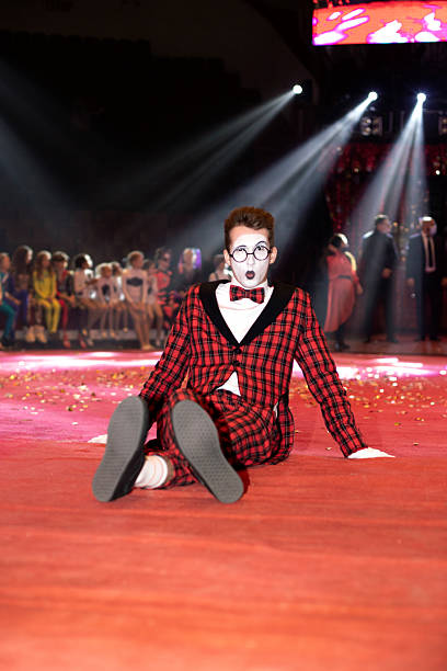 istock mime guy sitting on the floor 2254754909
