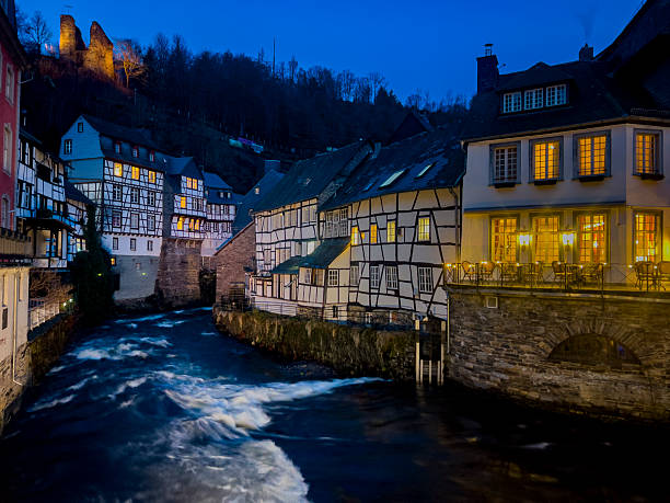 Night time in Monchau. Monschau is a small and very charming town located in the Eifel region of North Rhine-Westphalia, Germany. It is known for its narrow streets featuring medieval architecture, well-preserved half-timbered houses (Fachwerk), and the Rur River that flows through it.