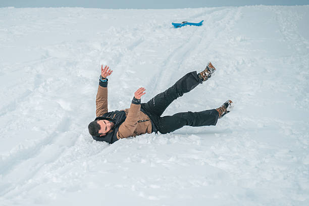 istock A man is laying in the snow, possibly after falling 2254761137