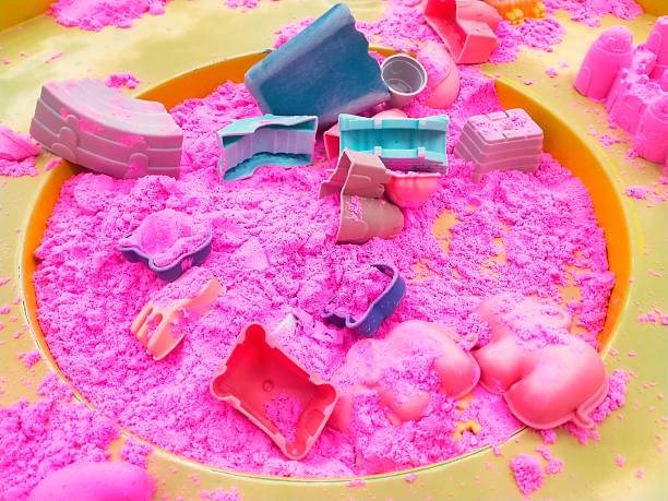 Pink sand in the box for children's play