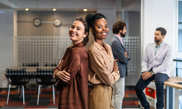 istock Successful diverse businesswomen smiling standing in modern office 2254767759