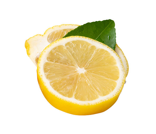 Top view of ripe yellow lemon fruit in  ellipse half and circle slice with green lemon leaf in stack isolated on white background with clipping path