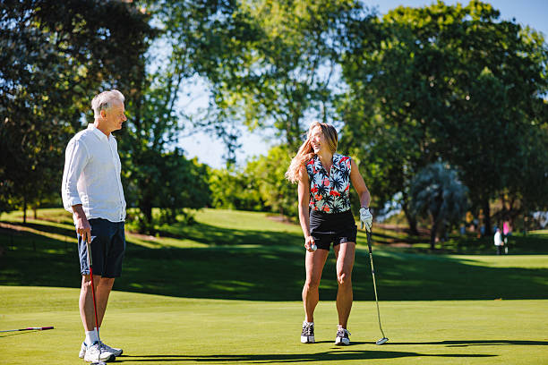 istock Delighted Mature Caucasian Couple Sharing Moment on Golf Course 2254768444
