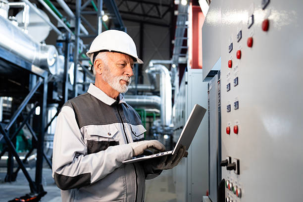 istock Factory electrician controlling power unit inside industrial setting. 2254768865