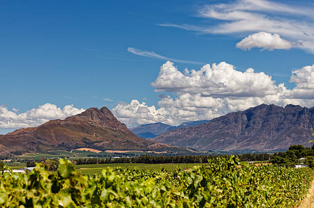 istock Amazing white clouds against a blue sky and high mountains. 2254771417