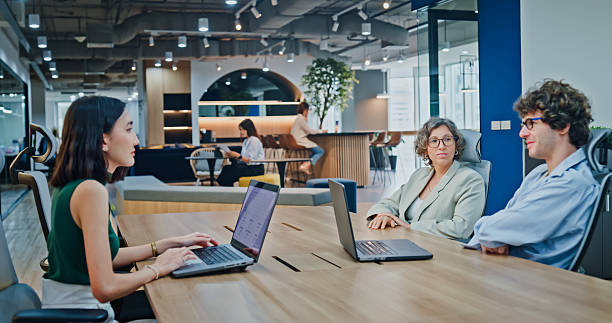 istock Diverse business team presents company data and performance charts meeting discussing strategy planning investment marketing strategies in modern office. Sustainable business and finance concept. 2254772824
