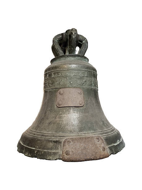 istock Old bronze church bell with inscriptions and riveted patches is isolated. 2254776169