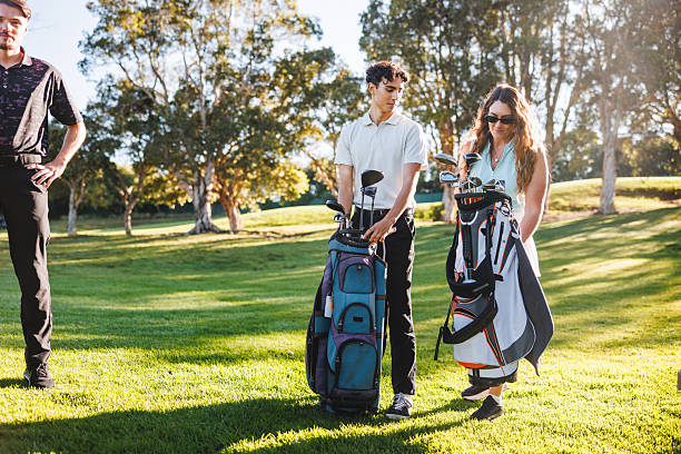 istock Young Caucasian Adults Preparing for Golf Game on Sunny Course 2254776689