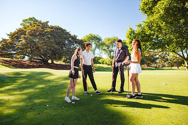 istock Young Adults Enjoying Conversation on Picturesque Golf Course 2254777431
