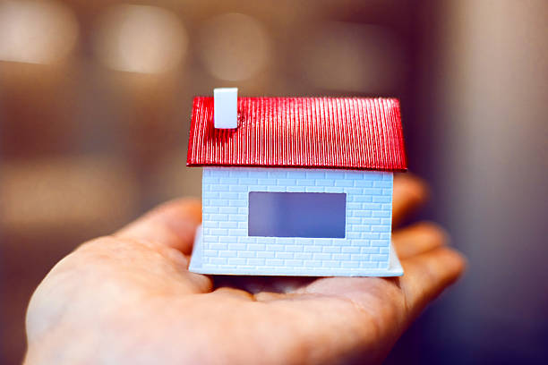 small blue house model against blue background