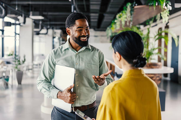 istock Business people collaborating discussing project in modern office 2254780073