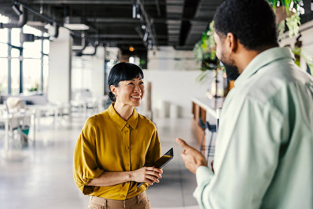 istock Diverse business colleagues having an informal discussion in modern office 2254780099