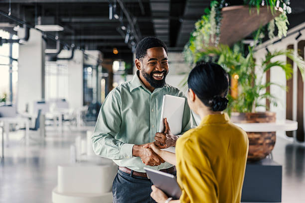 istock Business people shaking hands in modern office 2254780131