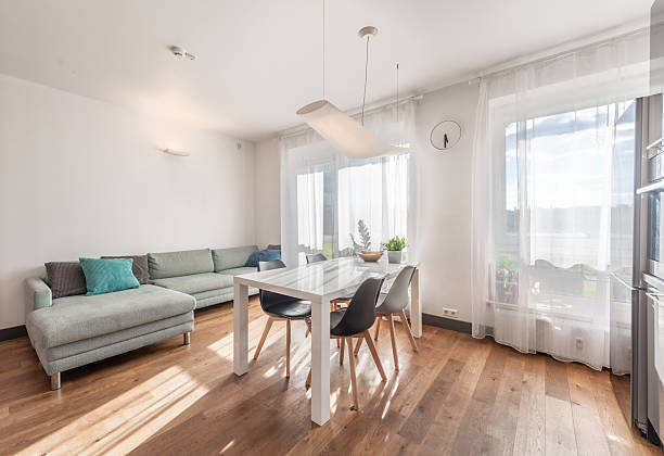 istock Modern Open Plan Living Room with Dining Area and Natural Light 2254784710