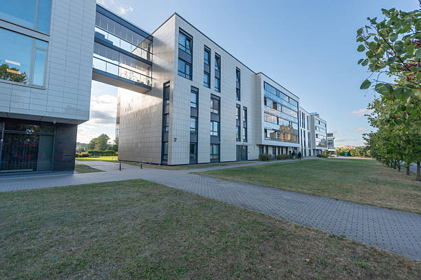istock Modern Office Building Surrounded by Greenery With a Clear Sky 2254784791