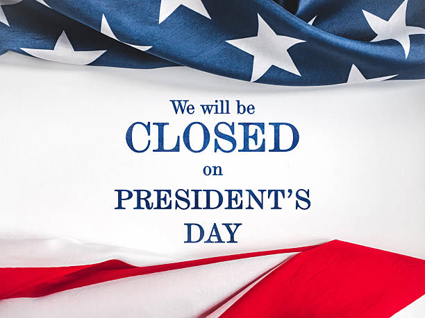 We will be closed for President's Day. American Flag and sign board with the inscription. Close-up, no people. Congratulations for family, relatives, friends, colleagues