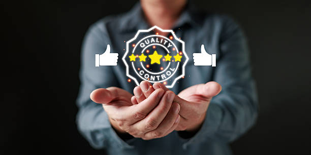 istock Quality control concept showing hands supporting a glowing five star badge, symbolizing high standards, customer satisfaction, product excellence, reliable service, and professional quality assurance. 2254786685